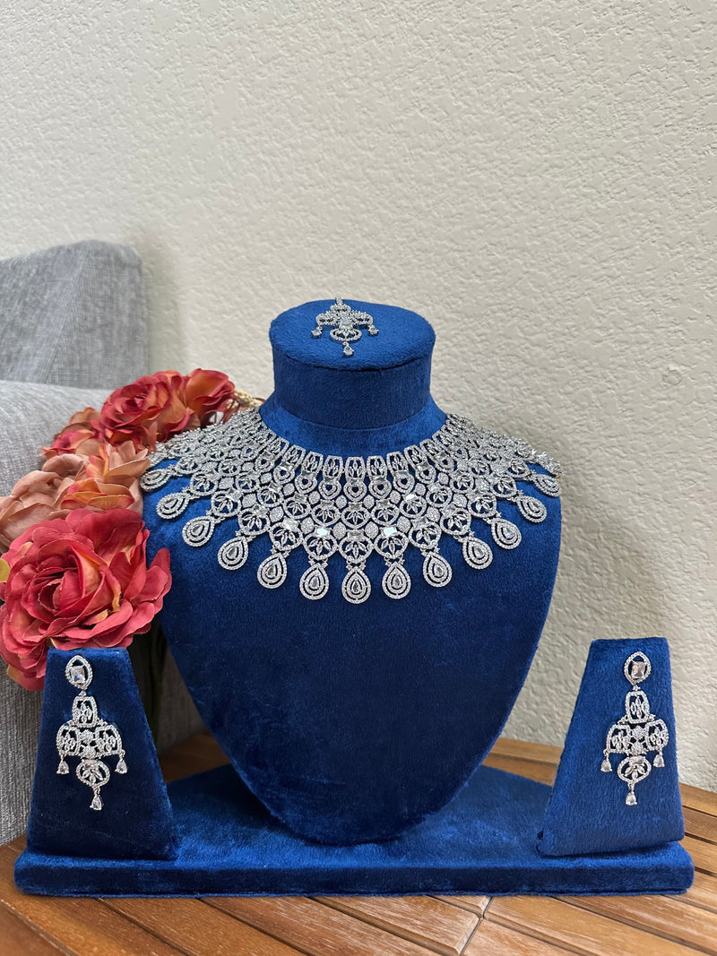 Full display of American diamond bridal necklace set with earrings and tikka