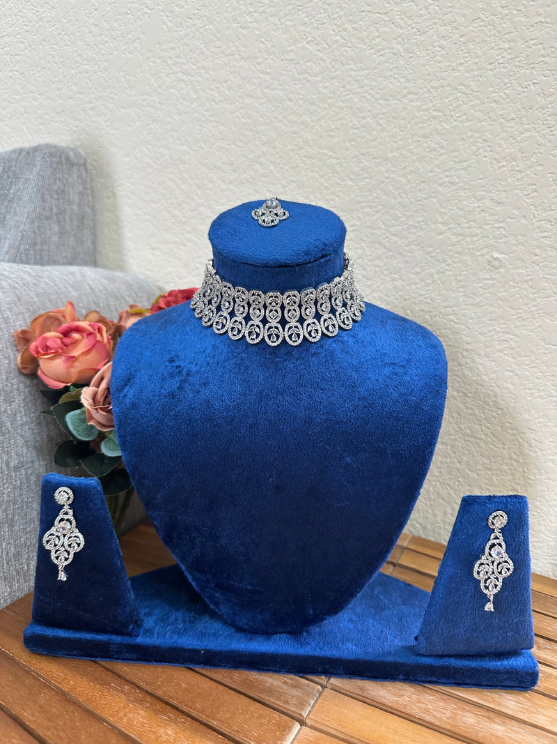 American diamond bridal necklace set with earrings on royal blue velvet display