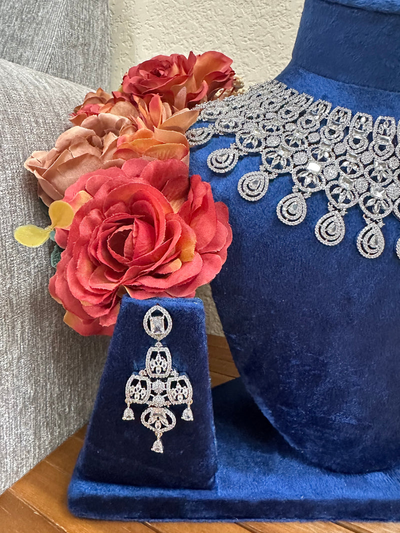 American diamond bridal earring detail with floral backdrop
