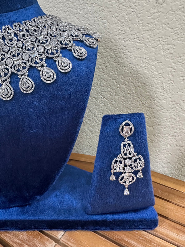 American diamond bridal earring close up on blue velvet stand