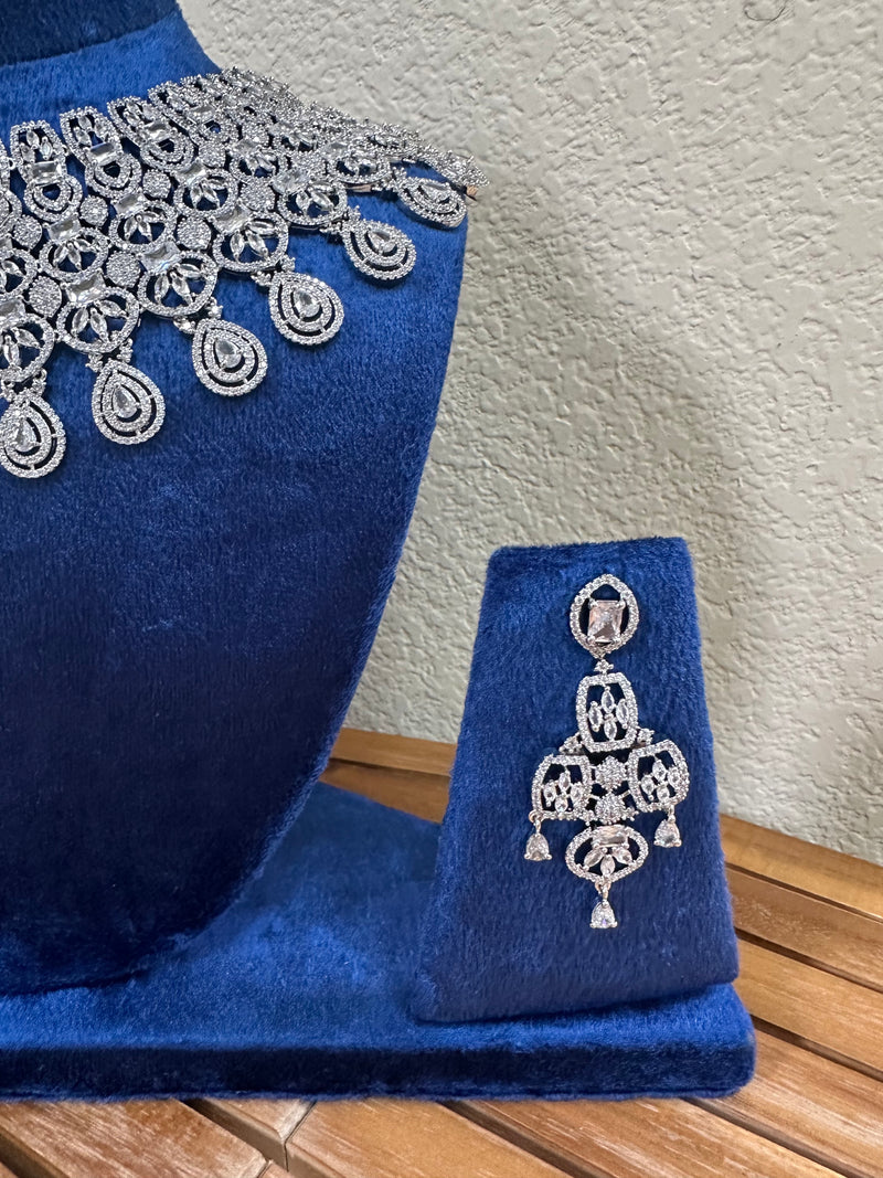 American diamond bridal earring close up on blue velvet stand