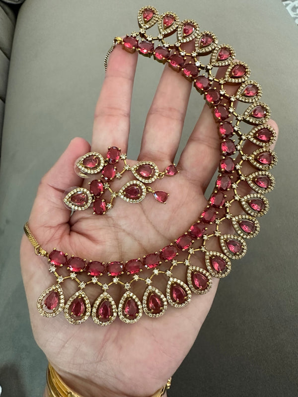 American diamond necklace and earrings set in ruby red with gold tone teardrop design
