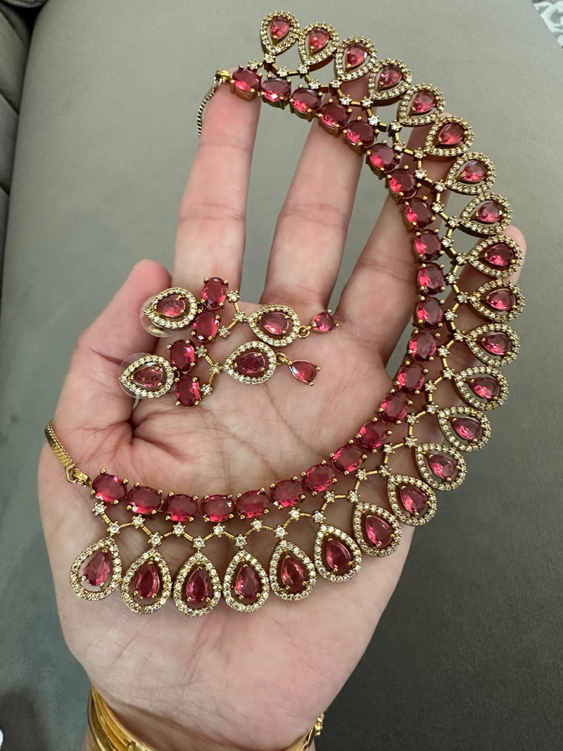 American diamond necklace and earrings set in ruby red with gold tone teardrop design