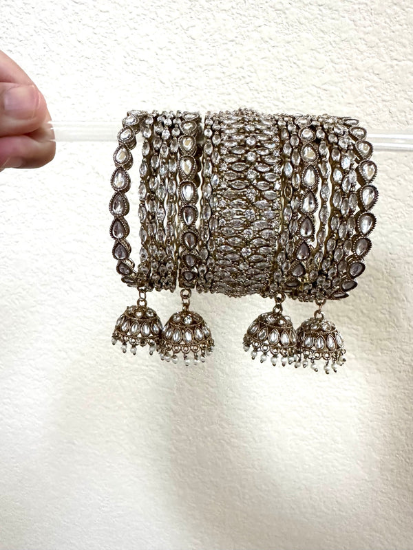 Antique gold 17-piece Indian bangle set in size 2.4 with kundan-style stones and jhumka charms