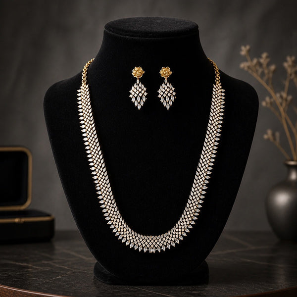 Antique gold American diamond necklace set with matching earrings displayed on a black jewelry bust