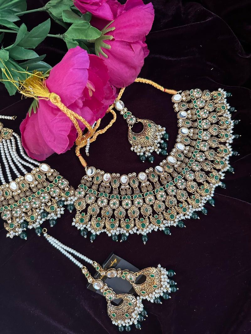 Antique gold bridal necklace set with green stones, jhumar, tikka and earrings