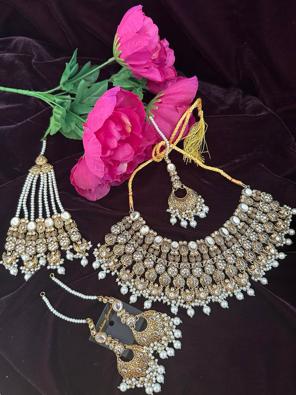 Antique gold bridal necklace set with white pearl and mirror stones, jhumar, tikka and earrings