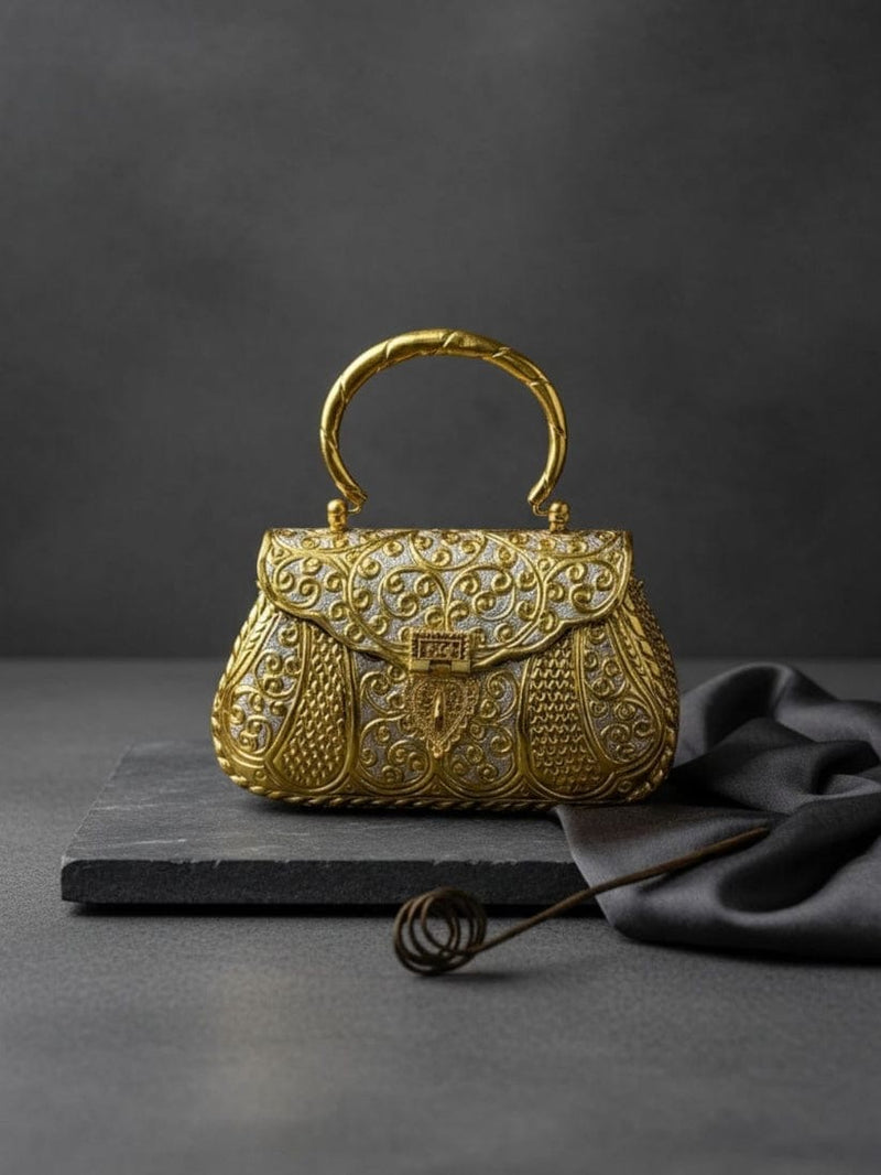 Antique gold hand carved metal clutch with engraved floral design