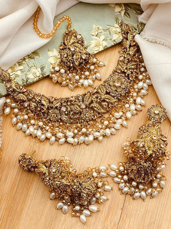 Antique gold pearl bridal necklace set with matching earrings and tikka
