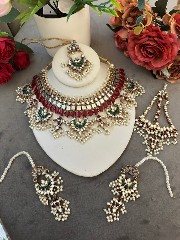 Traditional handcrafted Bahawalpur Pakistani bridal jewelry set with necklace earrings tikka pearls and red green stones
