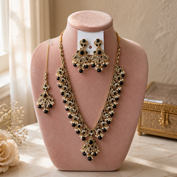 Black antique gold Kundan necklace set with earrings and tikka