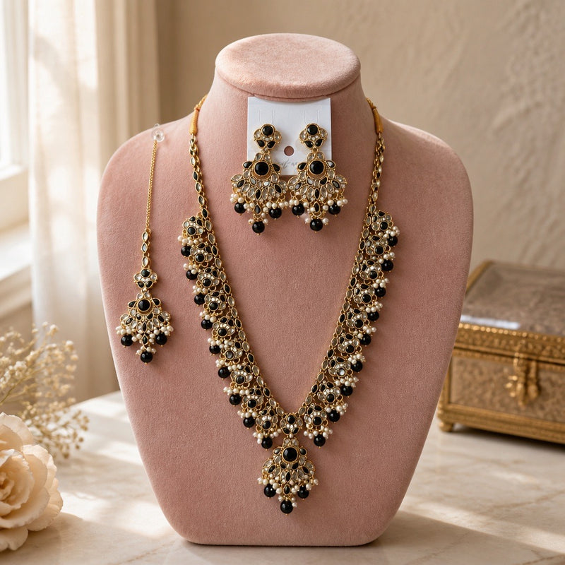 Black antique gold Kundan necklace set with earrings and tikka