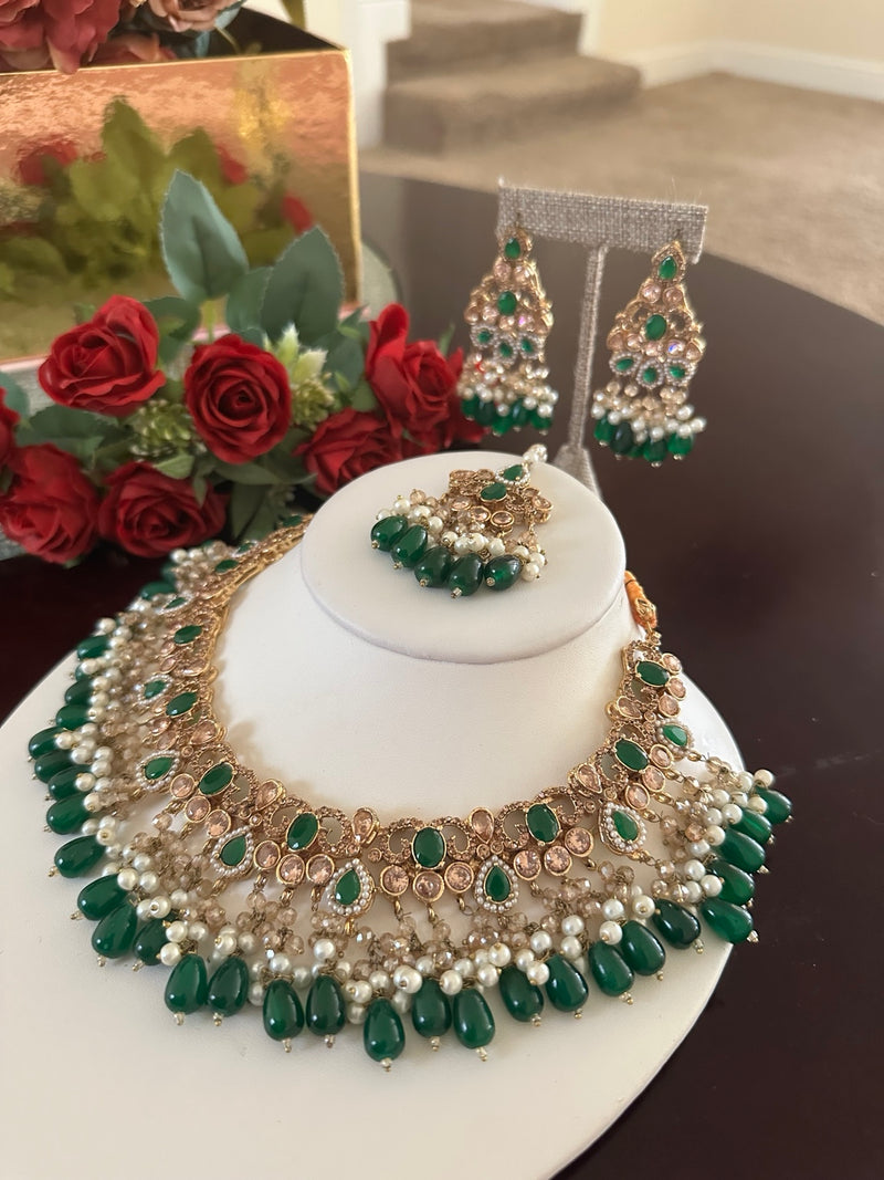 Emerald green kundan necklace set with pearl drops, matching earrings and tikka