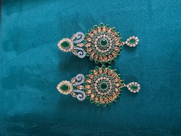 Emerald green statement chandbali earrings with gold tone and crystal detailing