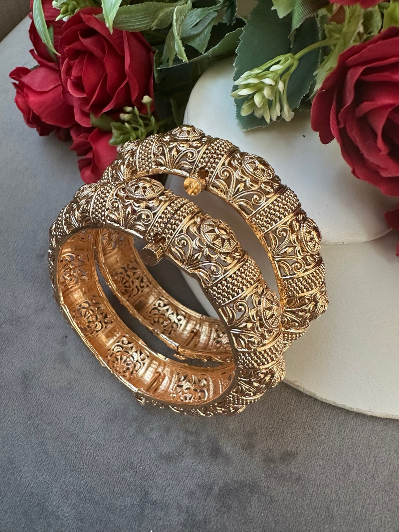 Gold color openable Madrassi bangles with ornate floral and scrollwork detailing, Design 1