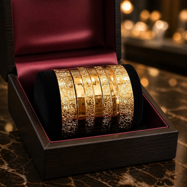 Gold plated bangle set size 2.6 with engraved floral design in luxury jewelry box