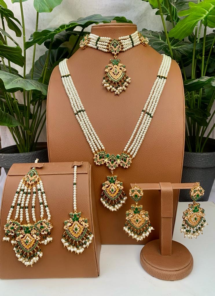 Green and pearl Kundan bridal jewelry set with long necklace, choker, earrings, tikka and hand jewelry