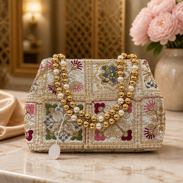 Handcrafted ivory patchwork floral fabric clutch with pearl and gold bead handle