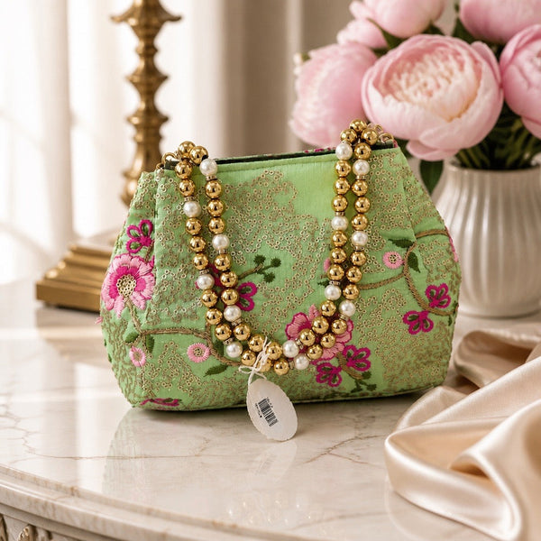 Handcrafted mint green floral fabric clutch with pearl and gold bead handle