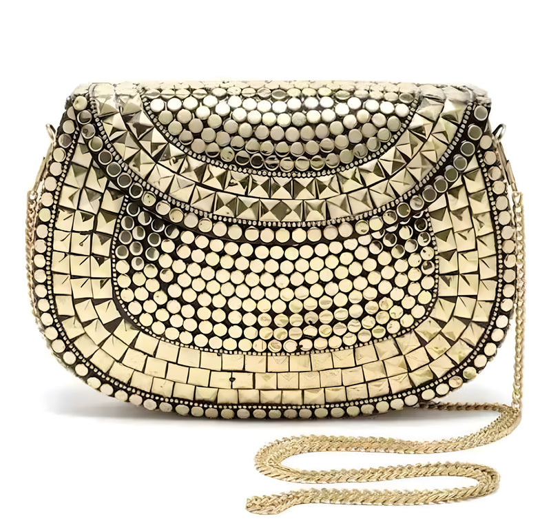 Close view of handcrafted metal mirror clutch with chain strap