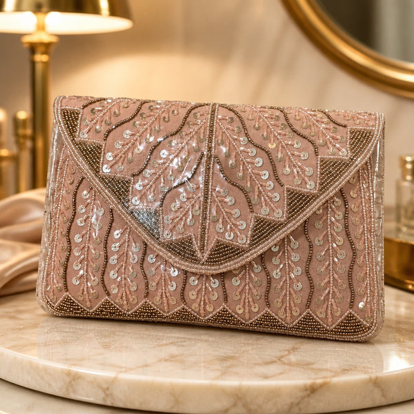 Handmade beaded clutch in blush pink with gold leaf embroidery and sequins