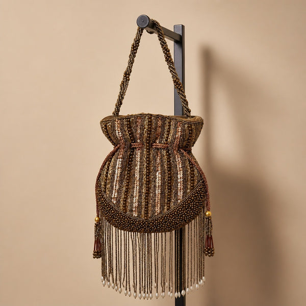 Handmade Indian bronze beaded potli purse with sequins, braided handle and pearl-tipped fringe