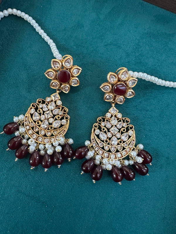 Close view of ruby garnet kundan chandbali earrings with pearl beads