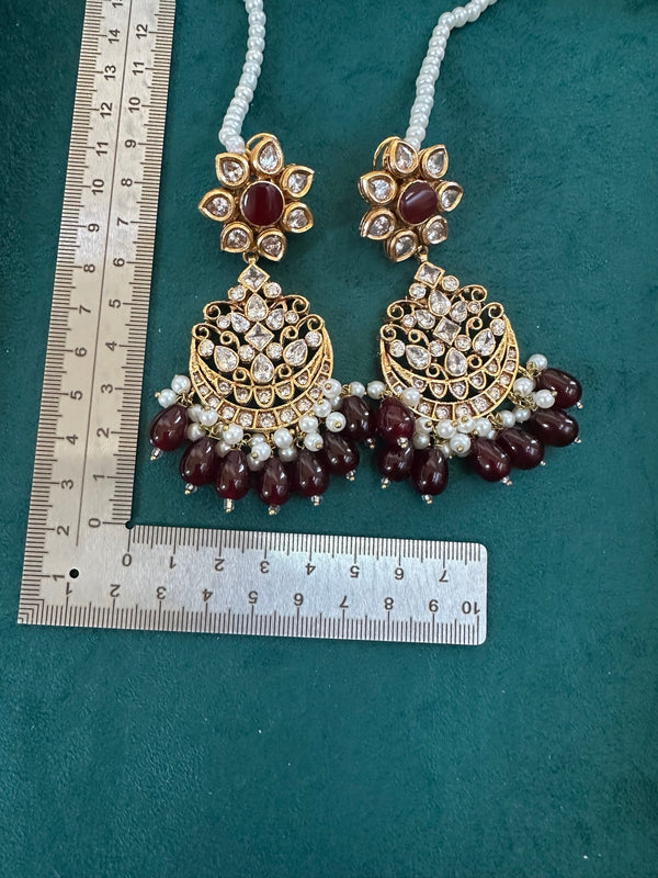 Kundan chandbali earrings in ruby garnet with pearls and measurement ruler