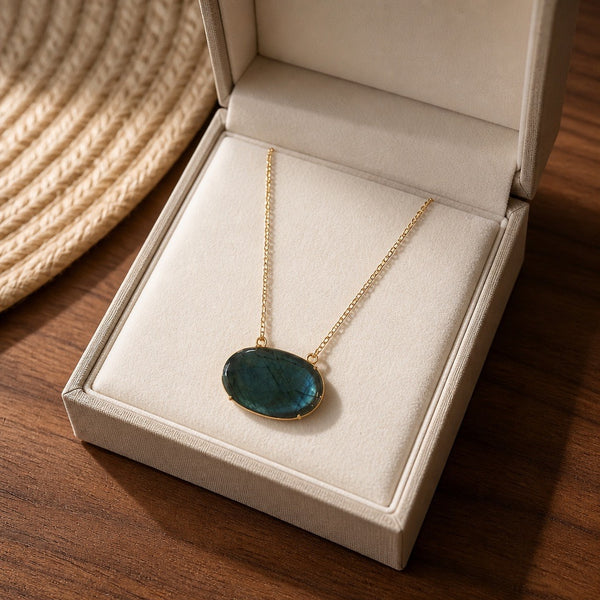 Labradorite oval natural stone pendant necklace displayed in a cream jewelry box