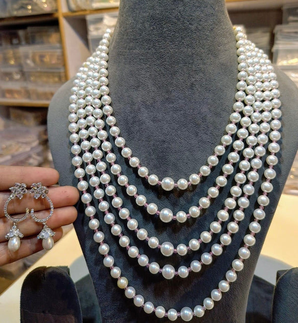 Layered round pearl necklace set with delicate crystal hoop drop earrings