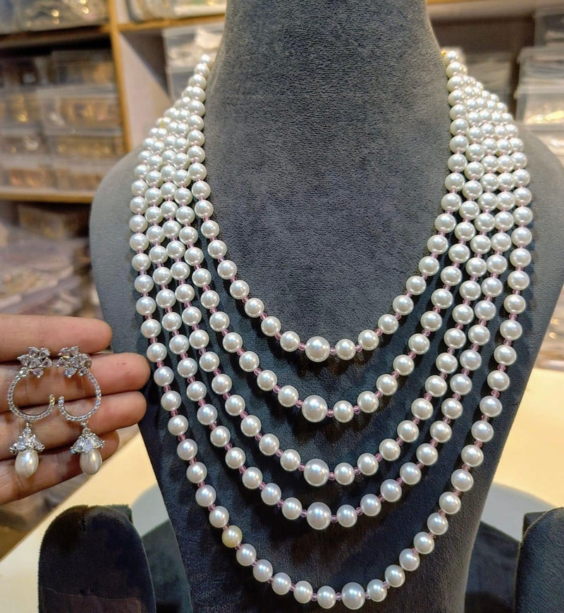 Layered round pearl necklace set with delicate crystal hoop drop earrings