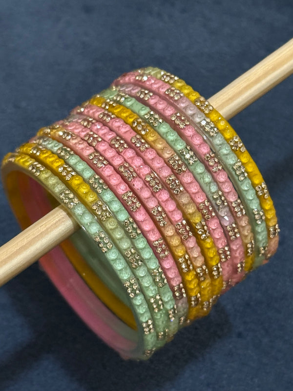 Light multicolor glass bangle set with pastel pink mint and yellow tones and sparkling crystal details