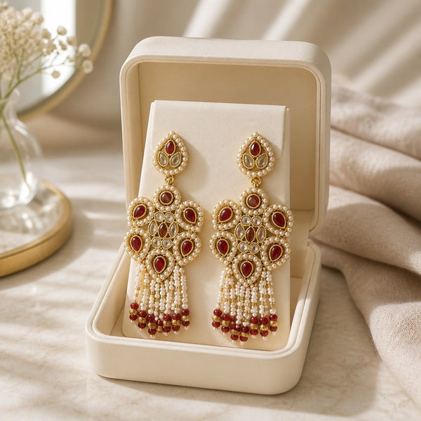 Maroon pearl Kundan statement earrings with tassel drops