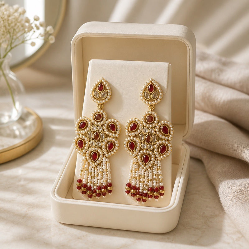 Maroon pearl Kundan statement earrings with tassel drops