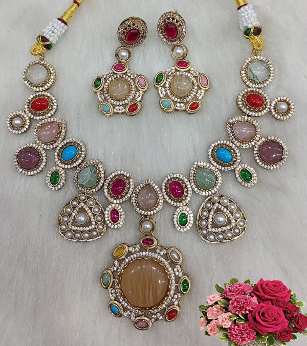 Multicolor cabochon gemstone statement necklace set with matching earrings and large round pendant displayed on a white background