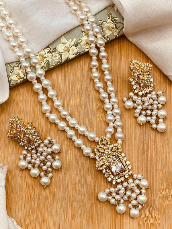 Pearl layered necklace set with matching gold tone earrings