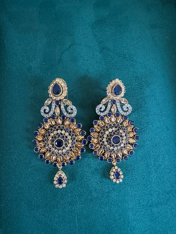 Sapphire blue round statement earrings with teardrop charm and gold tone finish